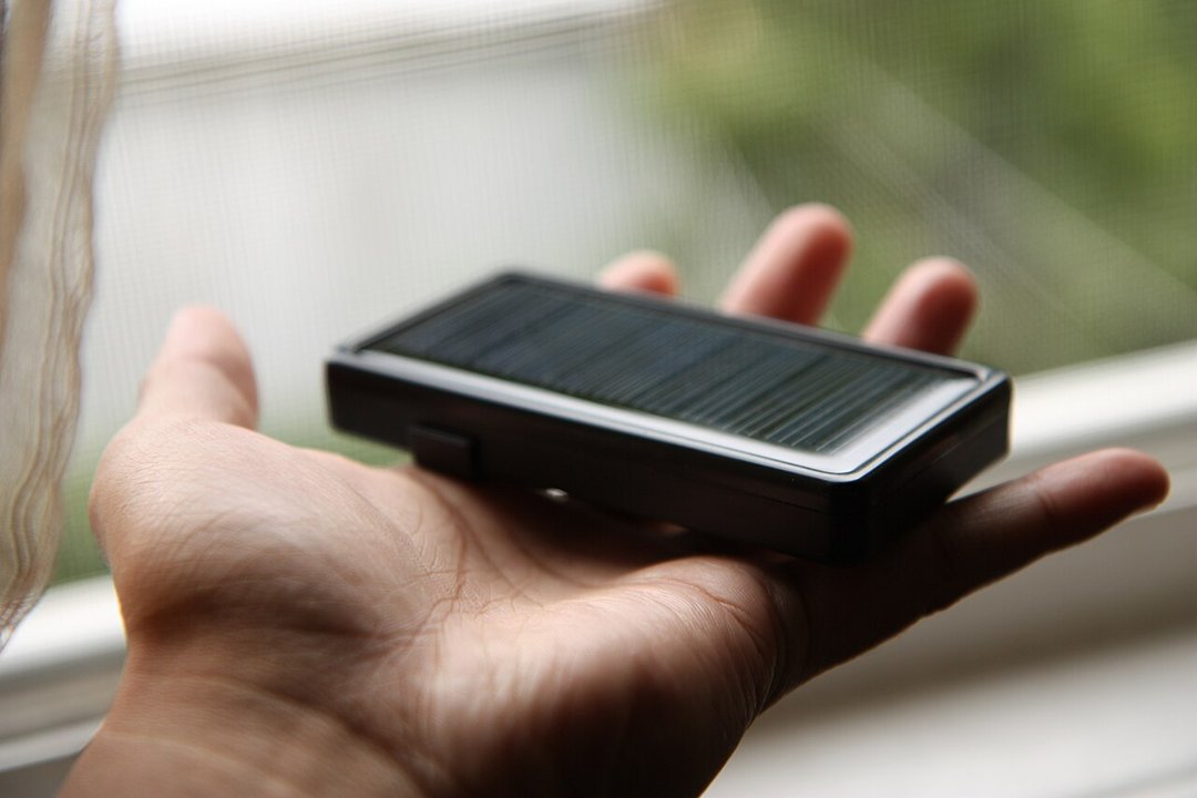 Solar power bank held in the hand